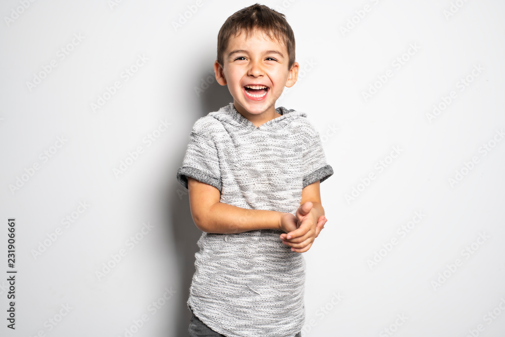 Boy having fun on studio white background Boy having fun on studio white background