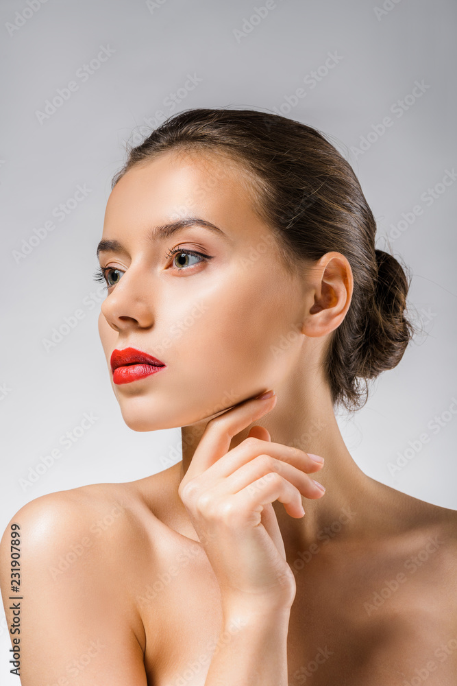young beautiful woman with red lips touching neck young beautiful woman with red lips touching neck
