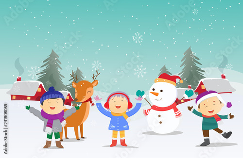 happy kids playing with snowman in winter season