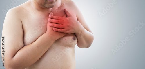 Asian fat man with chest pain, isolated on white background