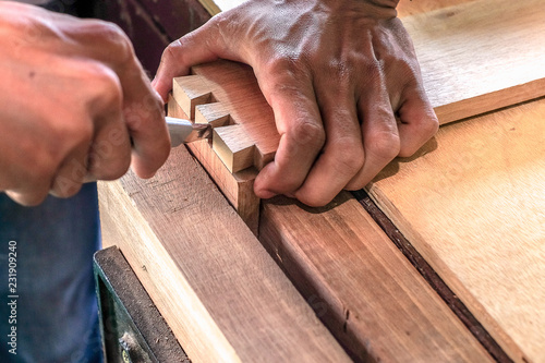 Fényképezés Skilled joiner working in carpentry