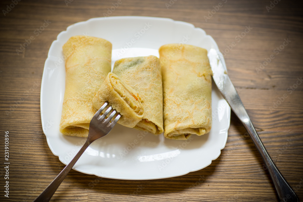 thin fried pancakes stuffed with stewed cabbage