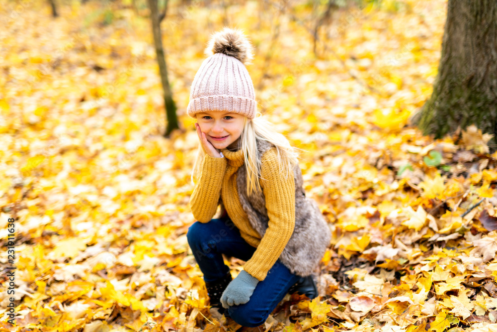 An Autumn portrait of cute blond child girl An Autumn portrait of cute blond child girl