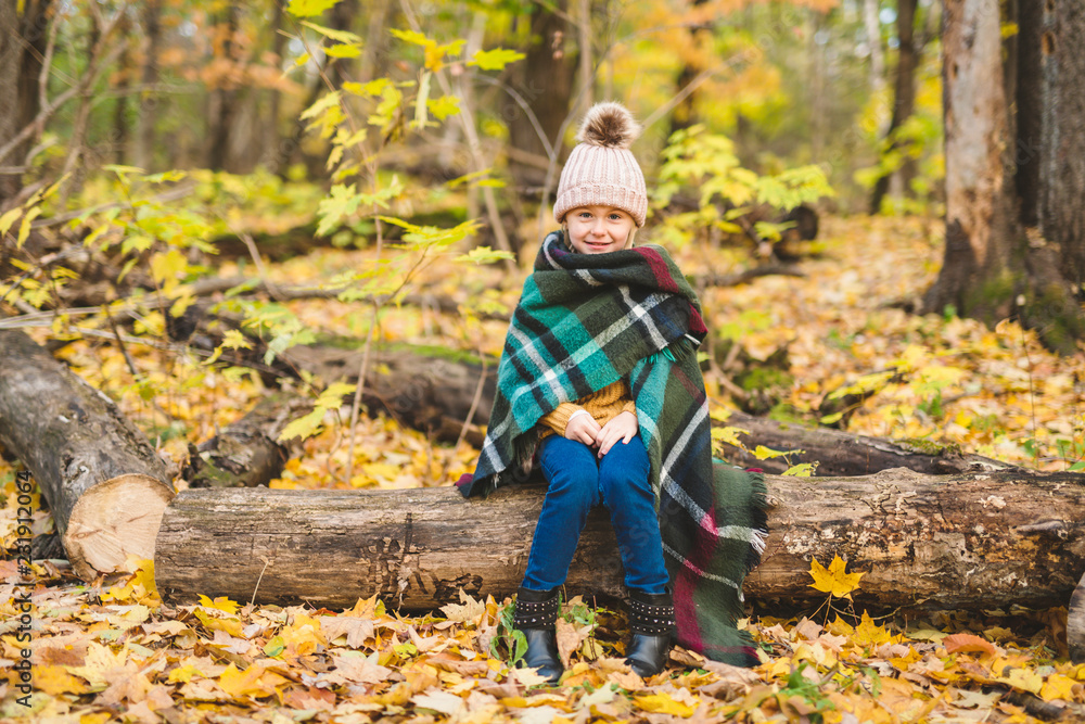 An Autumn portrait of cute blond child girl An Autumn portrait of cute blond child girl