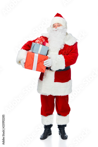 santa claus with white beard holding christmas presents isolated on white