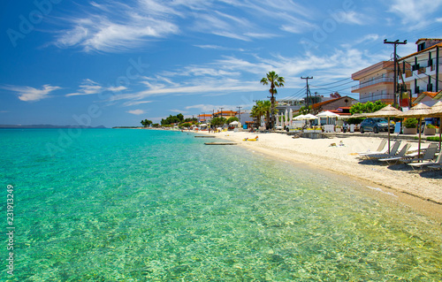Sandy beach with blue paradise water, Halkidiki, Kassandra, Greece photo