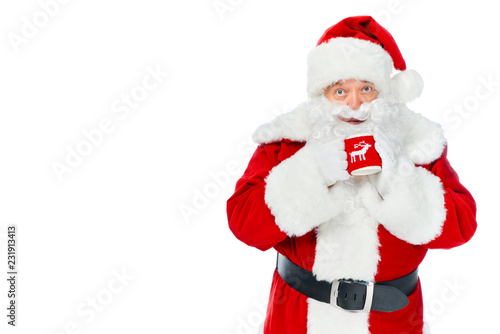 santa claus holding cup of hot coffee isolated on white