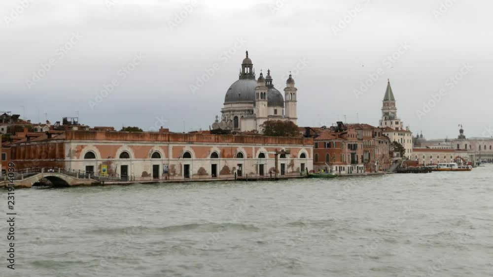 VENICE, ITALY- OCTOBER 30, 2018: view of Punta della Dogana and of the Basílica de Santa Maria della Salute VENICE, ITALY- OCTOBER 30, 2018: view of Punta della Dogana and of the Basílica de Santa Maria della Salute