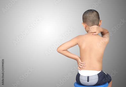 Asian kid with scoliosis, isolated on white background photo