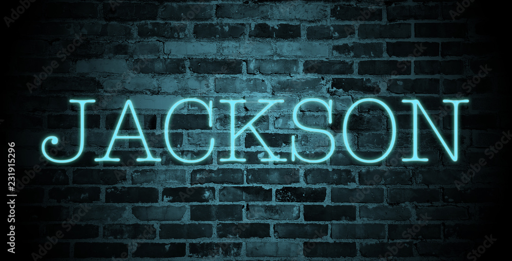 first name Jackson in blue neon on brick wall first name Jackson in blue neon on brick wall