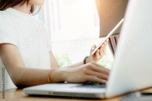 Young asian girl is freelancer with her private business at home office  working with laptop  coffee  online marketing  Customer order and packaging or packing.