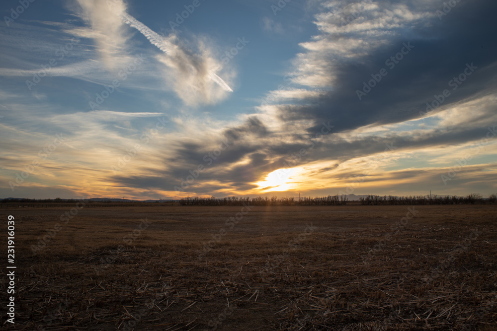 Obraz premium sunset over floodplain