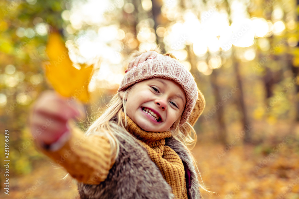 An Autumn portrait of cute blond child girl An Autumn portrait of cute blond child girl