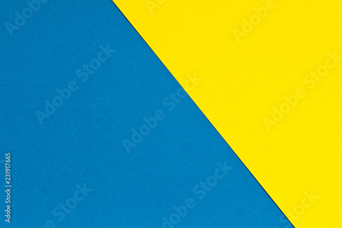 Blue and yellow background texture of colored paper. Trendy colors for design. Abstract geometric background
