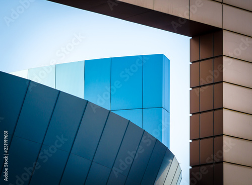 fragment of an office building with blue and yellow panels
