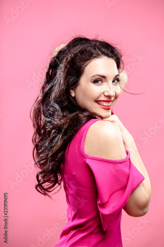 Wallpaper Mural Beauty portrait of young brunette woman on a bright pink background. Model with make-up and hairstyle, closeup, fashion glamour photo Torontodigital.ca