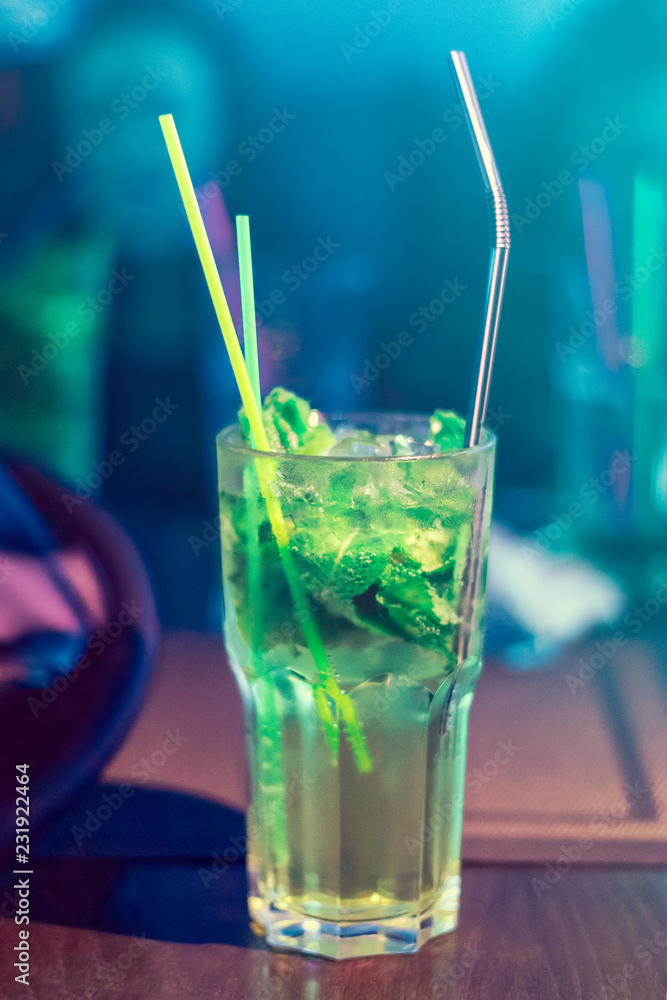 .Mojito in a transparent glass on the table. .Mojito in a transparent glass on the table.