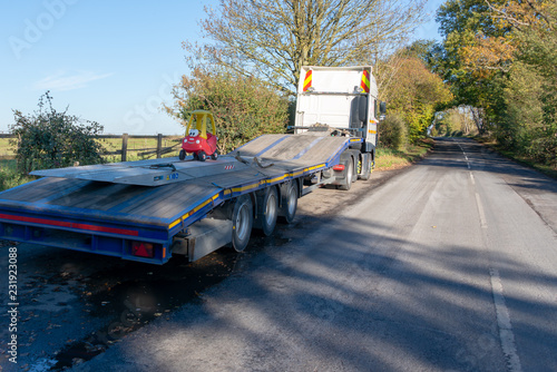 stratford upon Avon Warwickshire England UK November 2nd 2018 toy car transporter carries a light load on the back of a flat bed truck in a funny picture photo