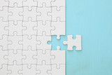 background of white puzzle with missing piece.