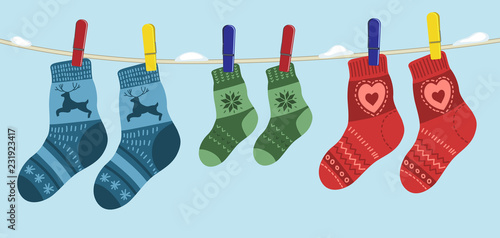 warm socks for family hanging on the rope.
