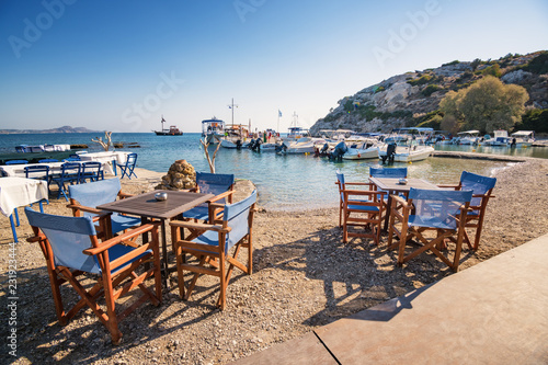 Tables and chairs near harbor in Kolymbia  Rhodes  Greece 