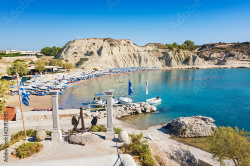 Fototapeta Naklejka Na Ścianę i Meble -  Kolymbia beach with umbrellas, sunbeds and boats (Rhodes, Greece)
