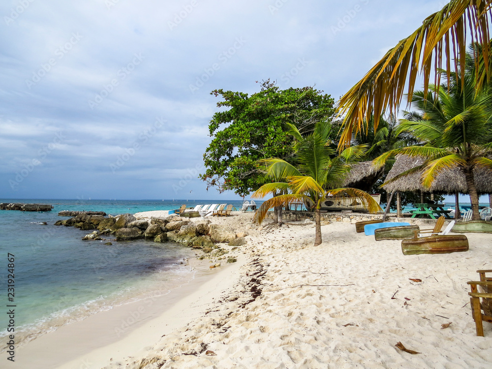 La Romana, Dominican Republic - Beautifull Beach with deckchair and white sand of a typical tropical island of the caribbean