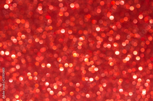 Sparkle glittering background. Glitter vintage lights background. Red. De-focused. Abstract bokeh lights.
