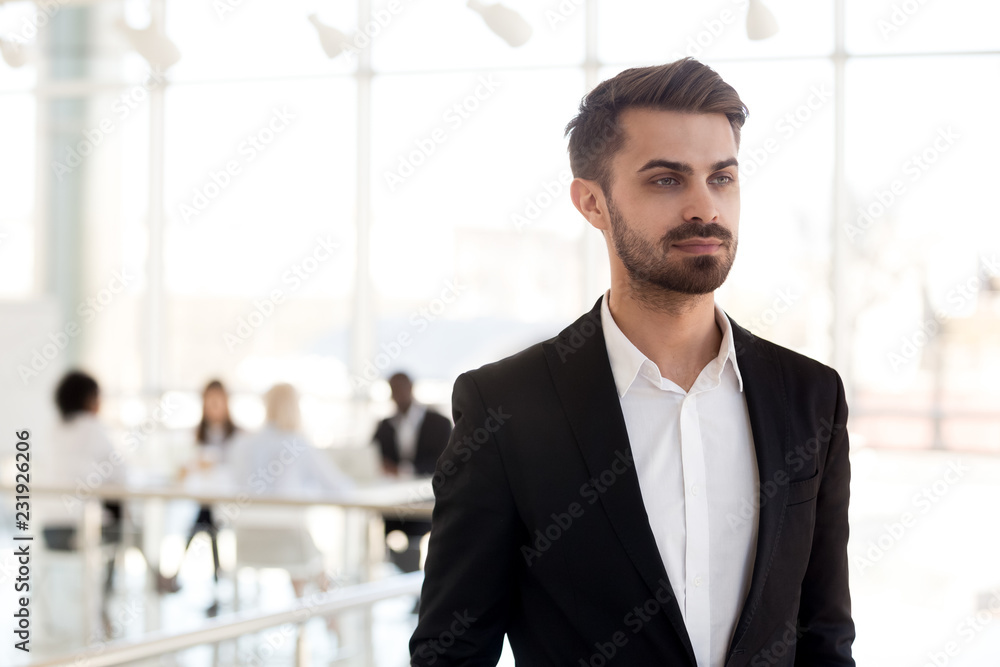Focused Caucasian millennial employee look in distance thinking about new work opportunities, concentrated thoughtful businessman dreaming of future success, making plans. Business vision concept Focused Caucasian millennial employee look in distance thinking about new work opportunities, concentrated thoughtful businessman dreaming of future success, making plans. Business vision concept