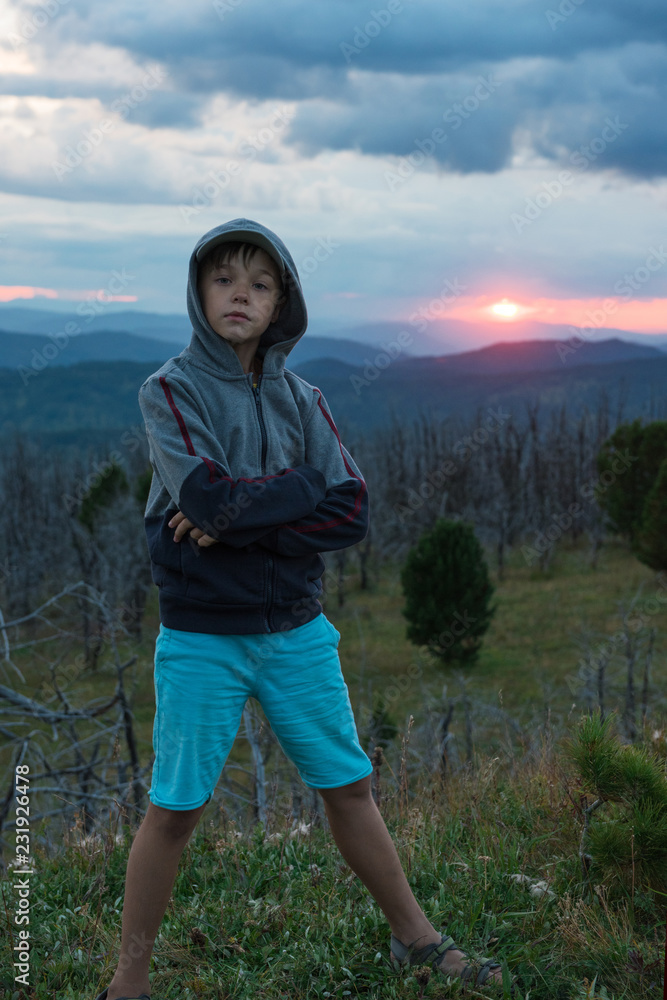 Boy at the evening in Altai mountains