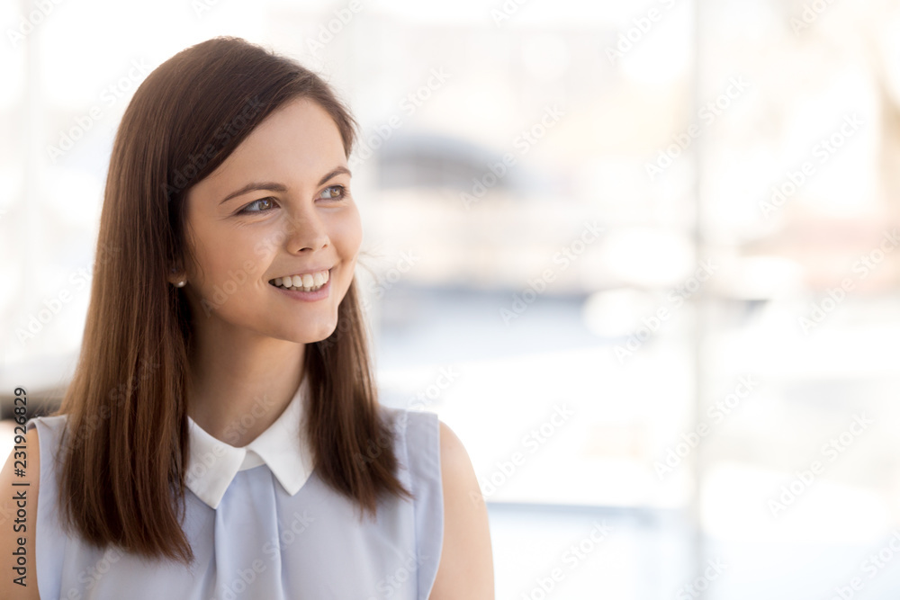 Excited female employee look in distance dreaming about career success, dreamy millennial woman thinking of new work opportunities, smiling worker make future plans. Business vision concept Excited female employee look in distance dreaming about career success, dreamy millennial woman thinking of new work opportunities, smiling worker make future plans. Business vision concept