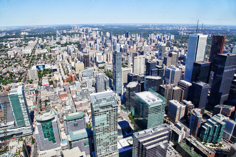 Aerial view of Toronto's downtown financial district showing skyscraper skyline of corporate business buildings.