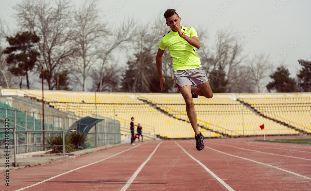 Man running in speed at sport ground