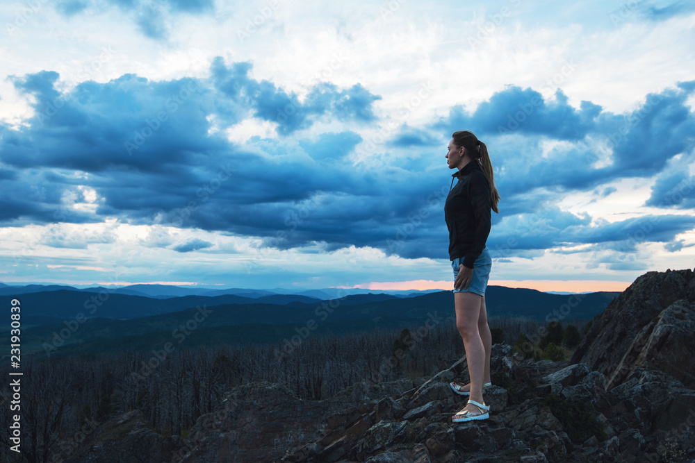 Obraz premium Travel, lesure and freedom concept - woman on the top of Altai mountain, beauty summer evening landcape