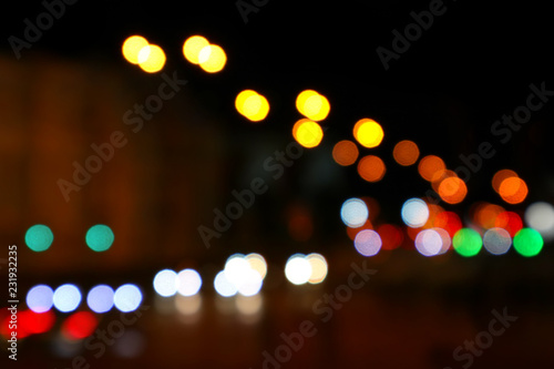 Color bokeh of light city street. Night city. Abstract background. © A Stock Studio