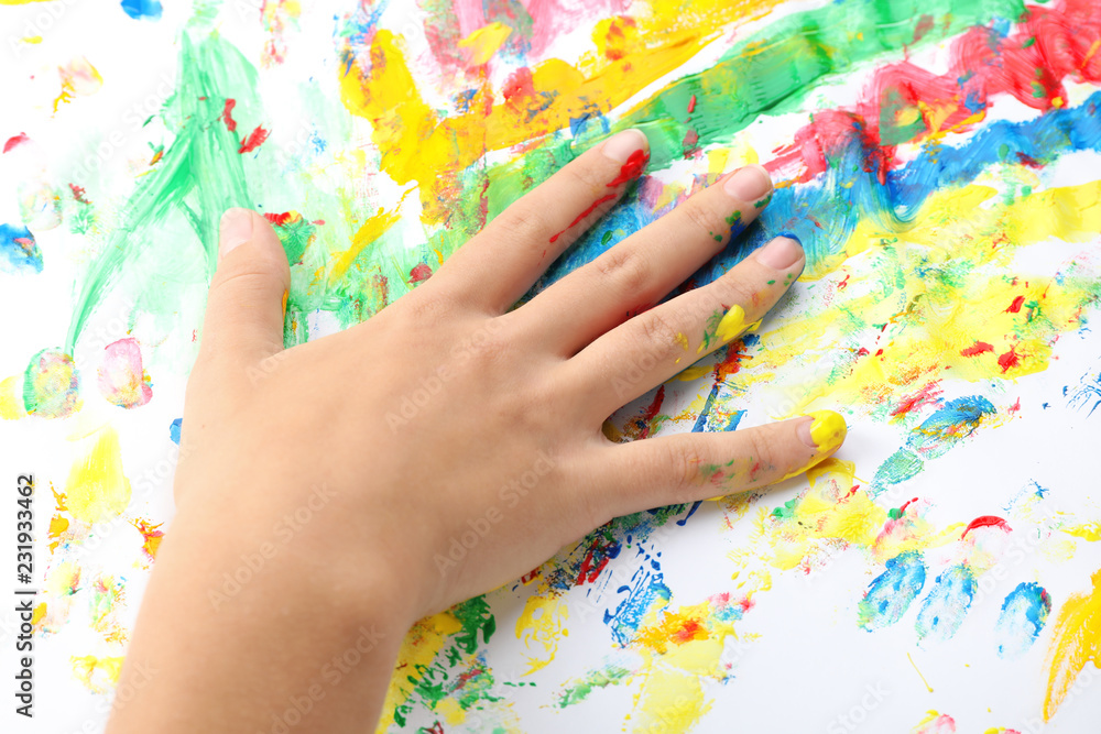 Child painting with hand on white background, closeup Child painting with hand on white background, closeup