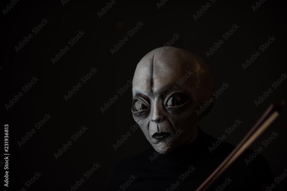 Alien enjoying playing violin Alien enjoying playing violin