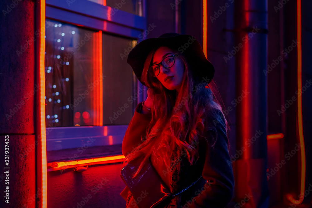 beautiful girl on a city street in the evening in the autumn beautiful girl on a city street in the evening in the autumn