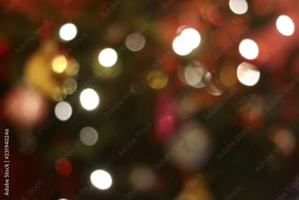 Defocused Christmas tree, colorful bokeh, Christmas background.
