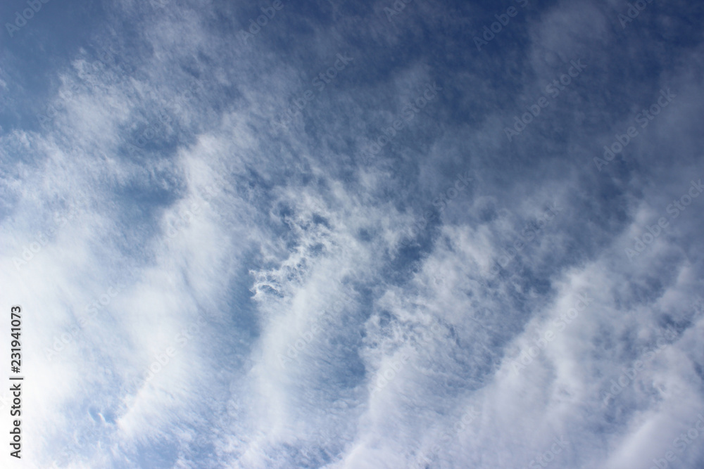 Cloud formation composition sun overcast white grey blue repetition lines streaks deep