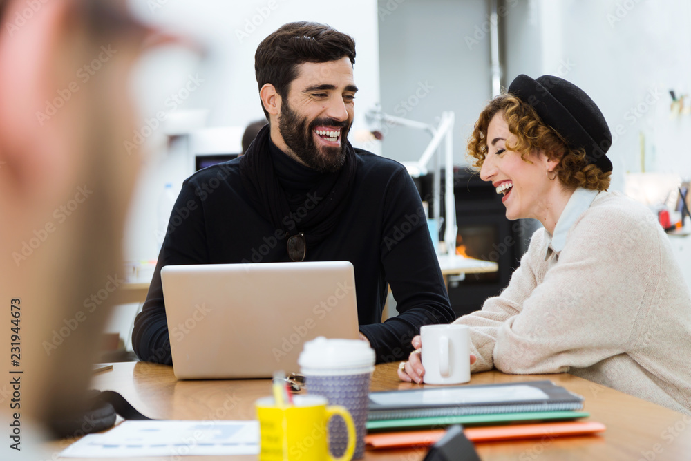 Laughing colleagues in office. Laughing colleagues in office.