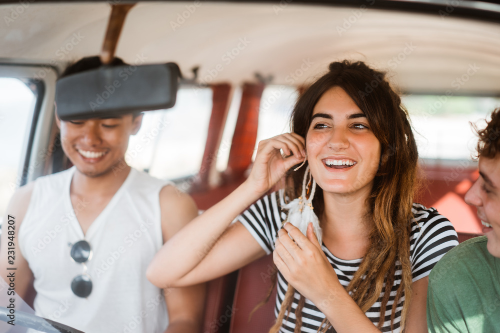 Group of hipster having fun with cheers inside on trip Group of hipster having fun with cheers inside on trip