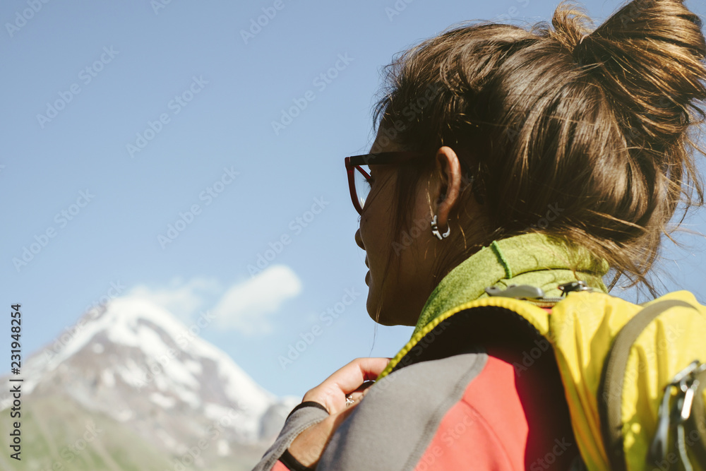 Young woman hiking in the mountains Young woman hiking in the mountains