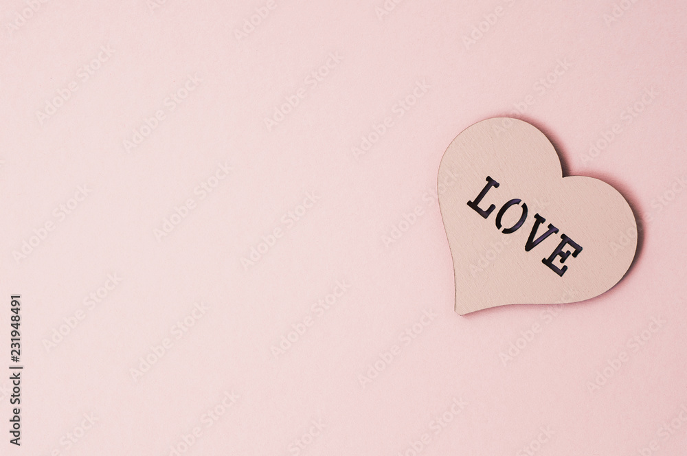 Heart of a pastel color with the inscription love. Holiday background Heart of a pastel color with the inscription love. Holiday background