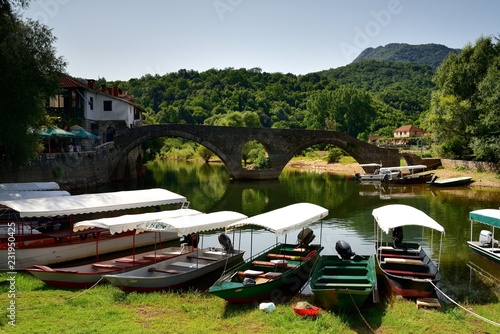 Arched bridge over the river photo