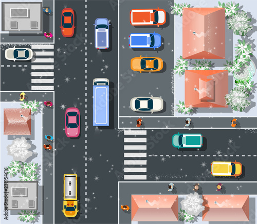 Top view Christmas New Year snow winter holiday from above on a city street speed highway with cars and buses, trees and trucks