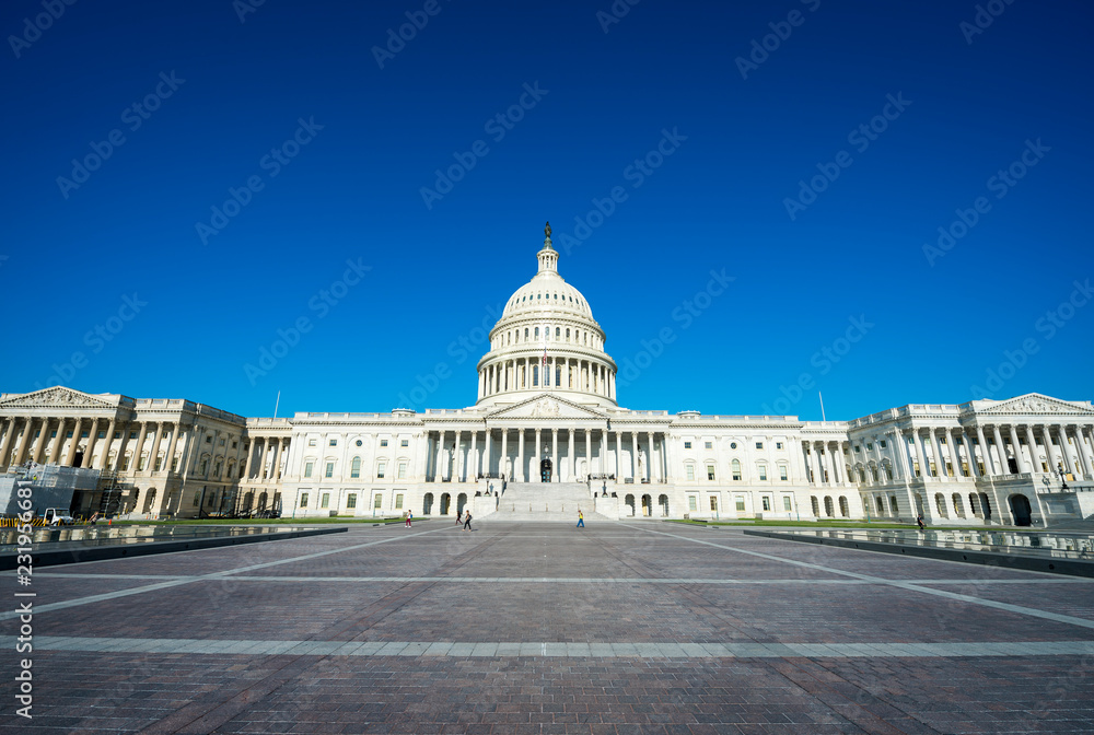 Bright scenic morning view of the empty plaza in front of the Capitol Building under blue sky in Washington, DC