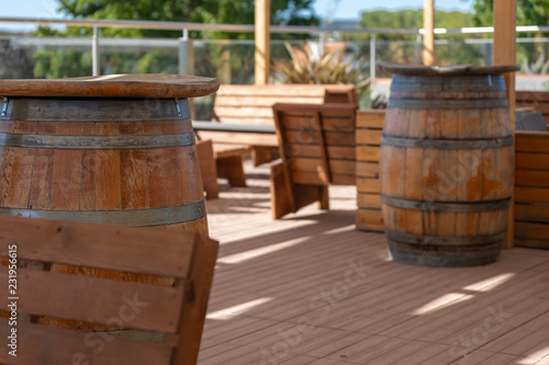 View of outdoor bar terrace, rustic wood, wooden barrels © Miguel Almeida