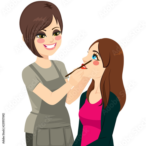 Professional female make up artist applying eyeliner on eye to model