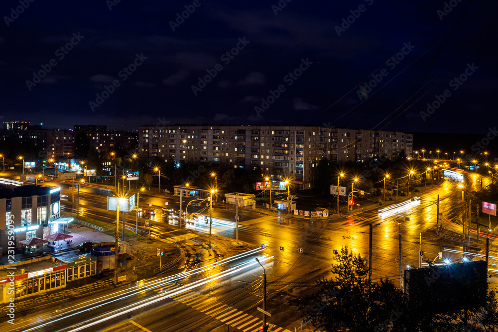 Aerial view of a massive highway intersection at night in Russia. Long exposure shot of a busy street at night creating dynamic effect of the vehicle lights.